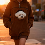 Cozy Pet Carrier Hoodie supplier lifestyle view in brown with a small dog during a sunset walk