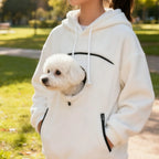 Cozy Pet Carrier Hoodie white park thumbnail showing a small dog carried in the front pouch