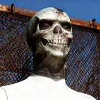 Cracked Skull Face Mask on a white mannequin outdoors, showing the skull print and neck coverage beside a metal fence.