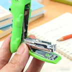Crocodile Mini Stapler opened to show the metal staple channel and spring mechanism