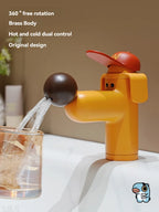 Cute Puppy Sink Faucet filling a glass, with brass body and rotating nose feature callouts