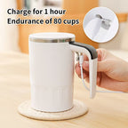Digital Self-Stirring Mug white mug with lid fitted and a cable connected beneath the handle for USB charging.