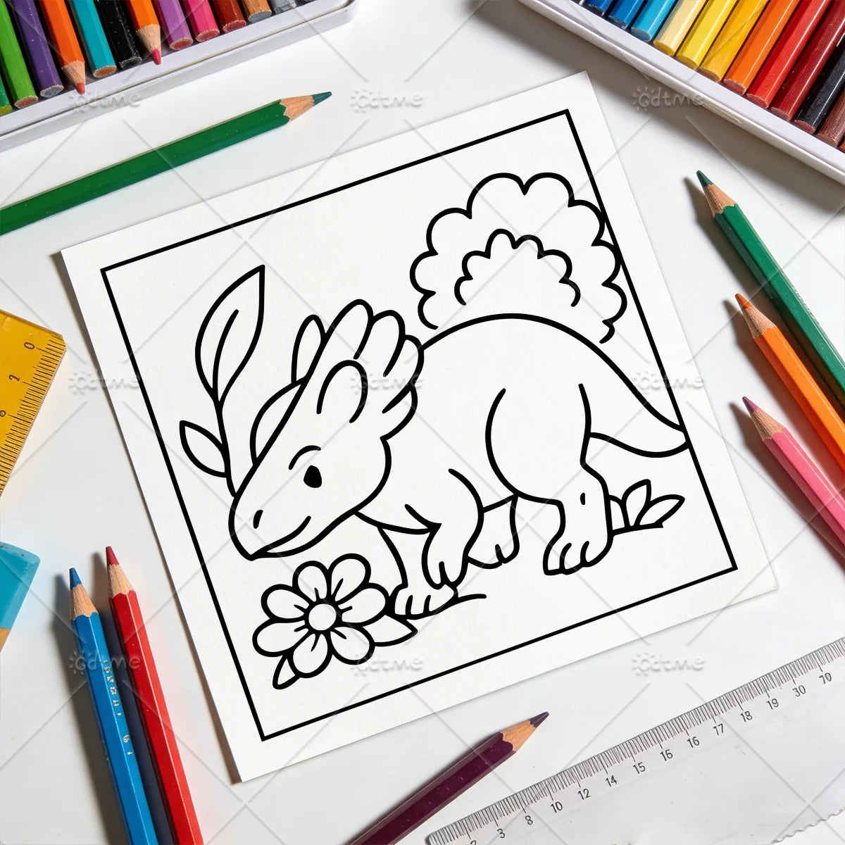 Uncolored horned dinosaur page from Dino Friends Coloring Book on a desk with colored pencils and rulers