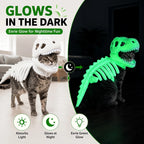 Dinosaur Skeleton Pet Costume: Cat wearing white costume in daylight and glowing green in the dark.