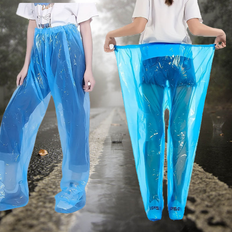 Disposable Rain Pants in blue shown worn on a wet road with the elastic waistband stretched