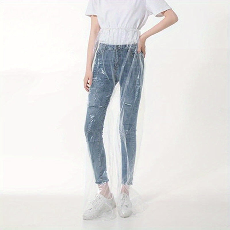 Transparent Disposable Rain Pants shown full length over dark pants and white sneakers