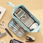Double Compartment Pencil Case in blue on a desk with a calculator and stationery demonstrating storage.