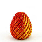 Dragon Egg Fidget Toy in a glossy red finish shown upright against a white background