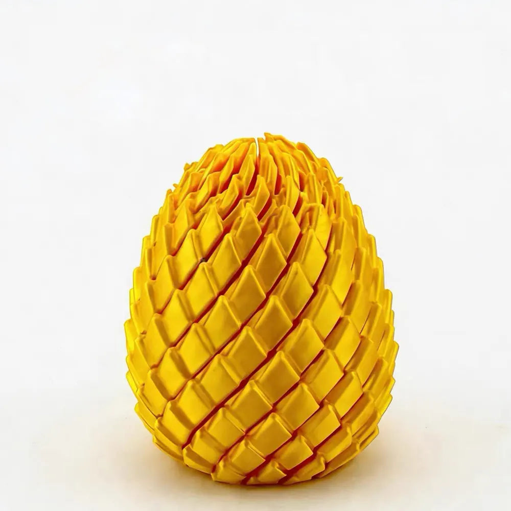 Dragon Egg Fidget Toy in bright yellow showing the layered scale pattern and egg shape