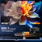 Dream J9 MiniProjector 800:1 contrast comparison showing a colorful flower projection