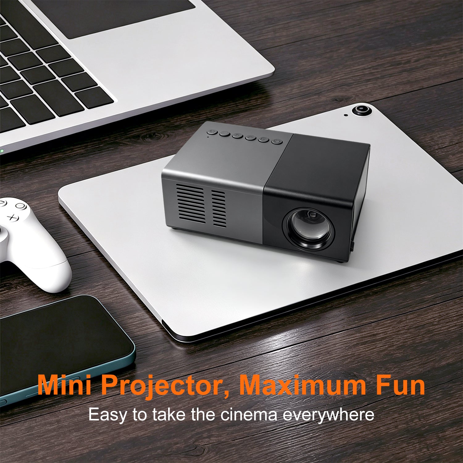 Dream J9 MiniProjector in black on a laptop during a compact gaming desk setup