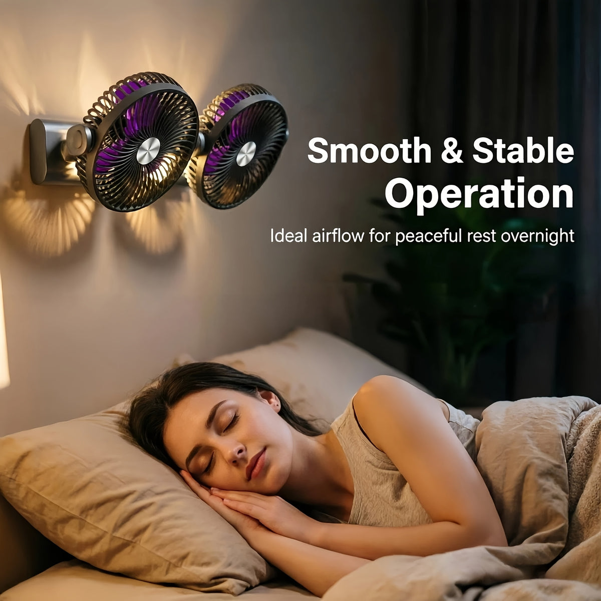 Charcoal Dual Head Portable Fan wall-mounted above a bed with its warm night light switched on