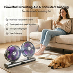 Charcoal Dual Head Portable Fan beside a sofa with a seated woman, an open book and a resting dog