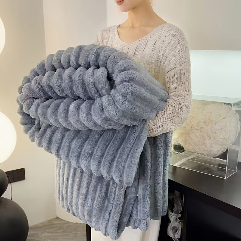 Cozy Fuzzy Blanket in plush gray faux fur with ribbed texture, folded to display luxurious double-sided warmth