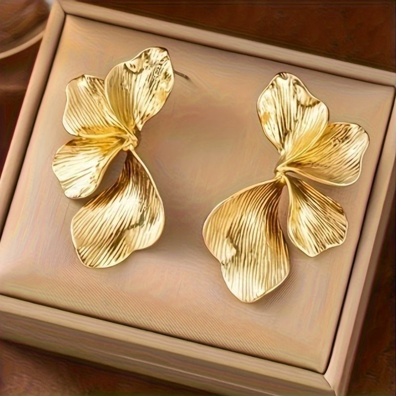 HighPeak Exaggerated Petal Earrings in textured gold copper with bold sculptural design displayed in a beige jewelry box