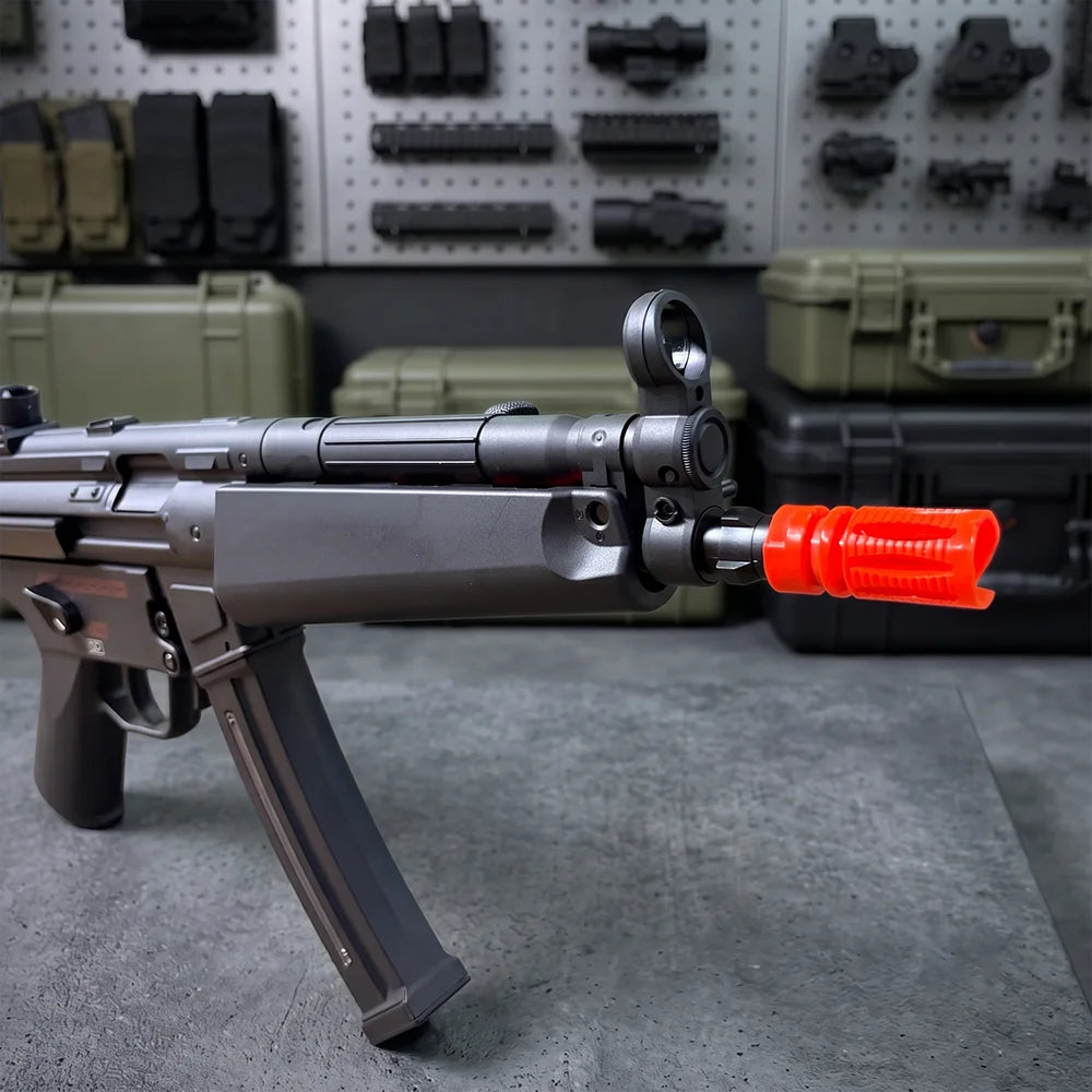 Electric SMG Gel Blaster front section close-up highlighting the bright orange tip and circular sight