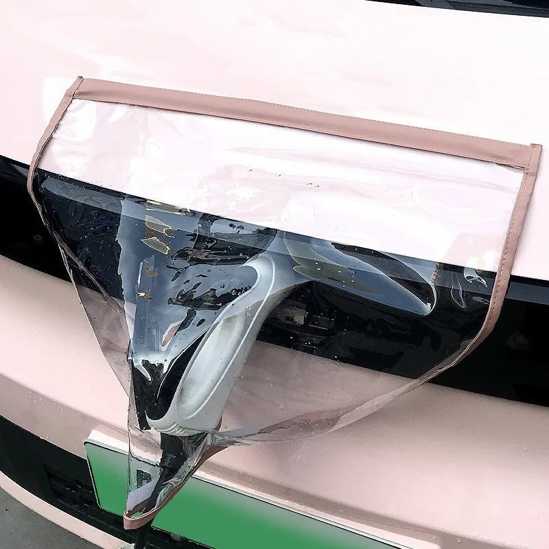 EV Charging Rain Cover — Pink-edged clear cover over a front charging connector with visible water droplets.