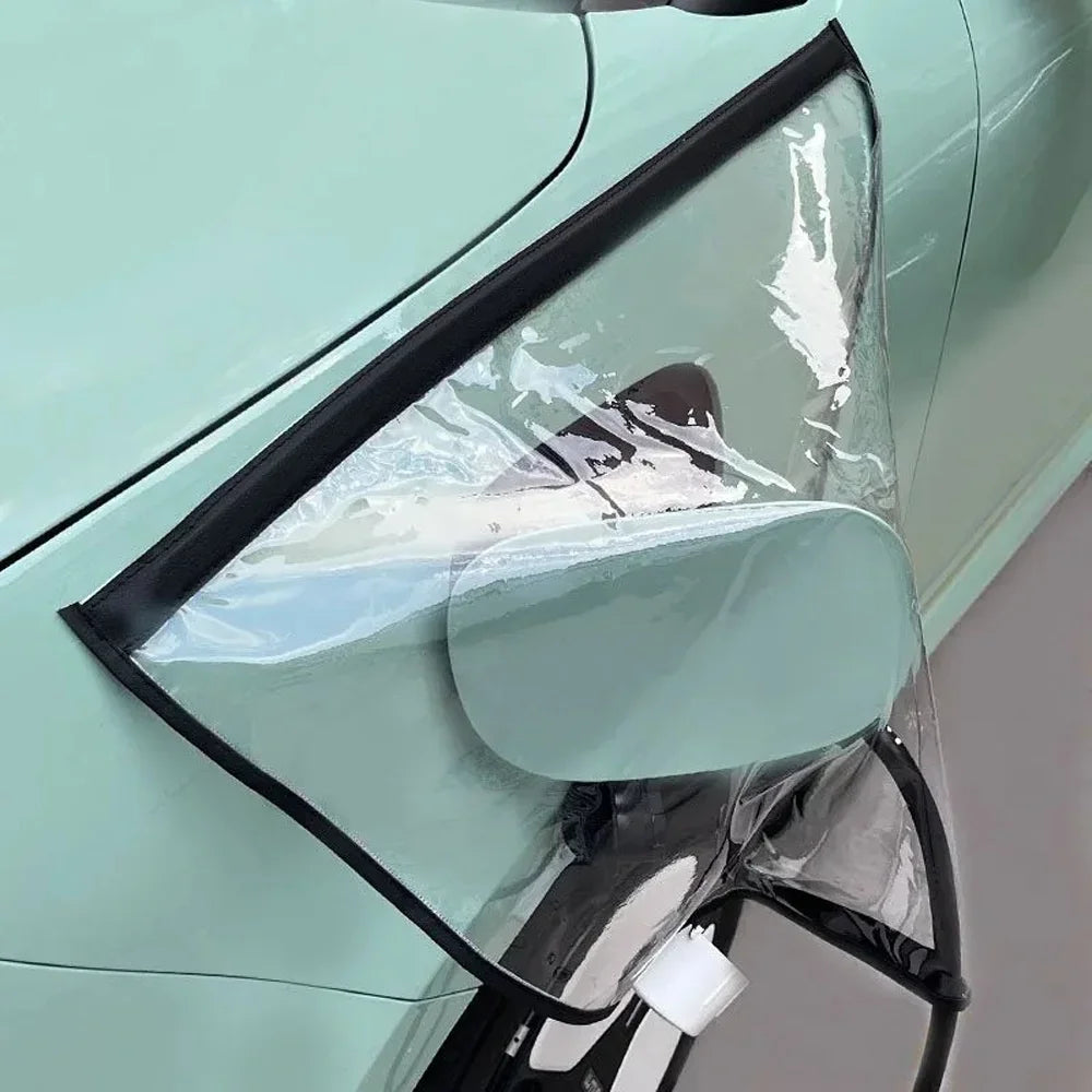 EV Charging Rain Cover — Side view of the clear black-trim cover surrounding the flap and cable on a mint car.