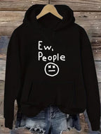 "Ew, People" Hoodie in black hanging in a full front view with hood, pocket, and print