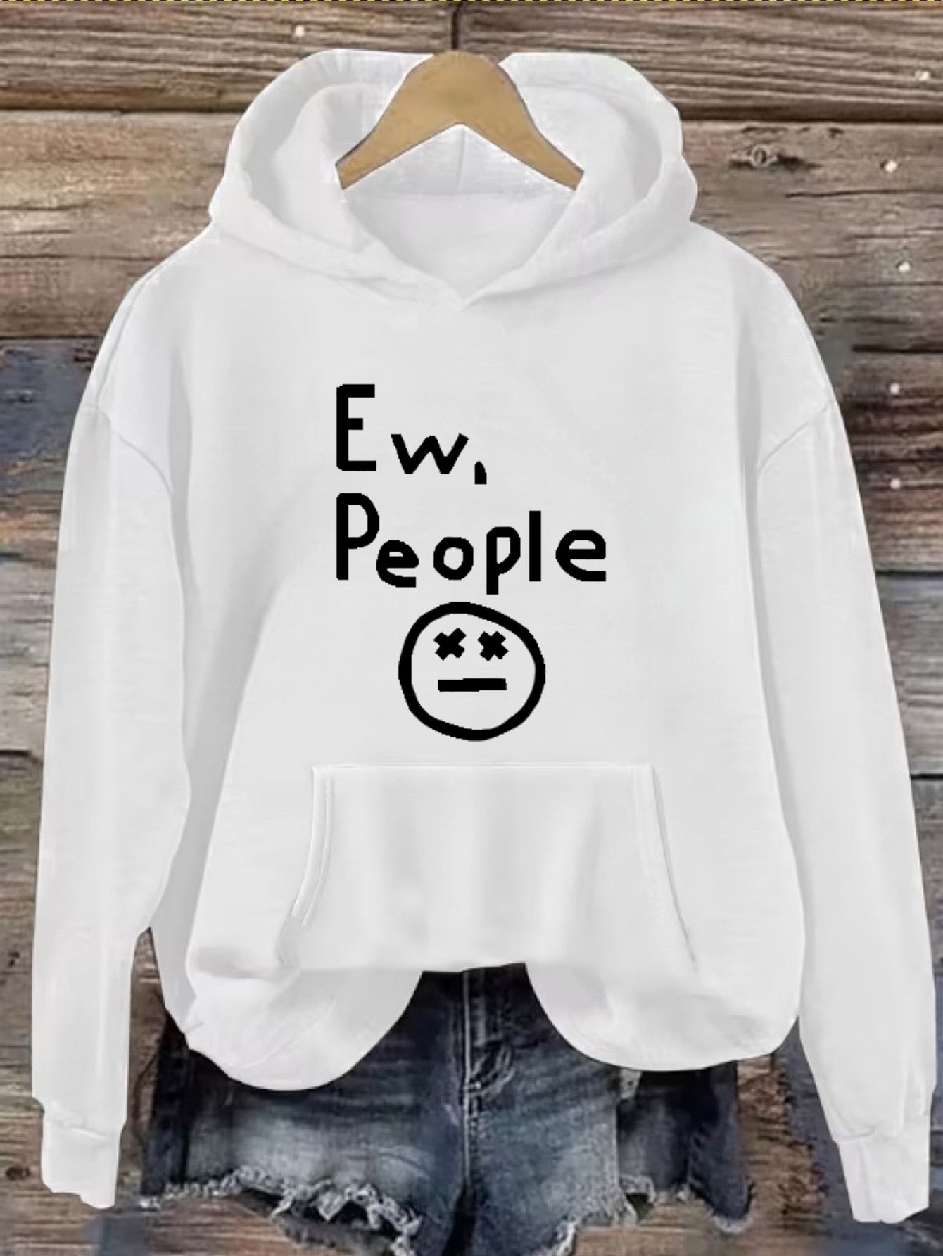 "Ew, People" Hoodie in white hanging in a full front view with hood, pocket, and print