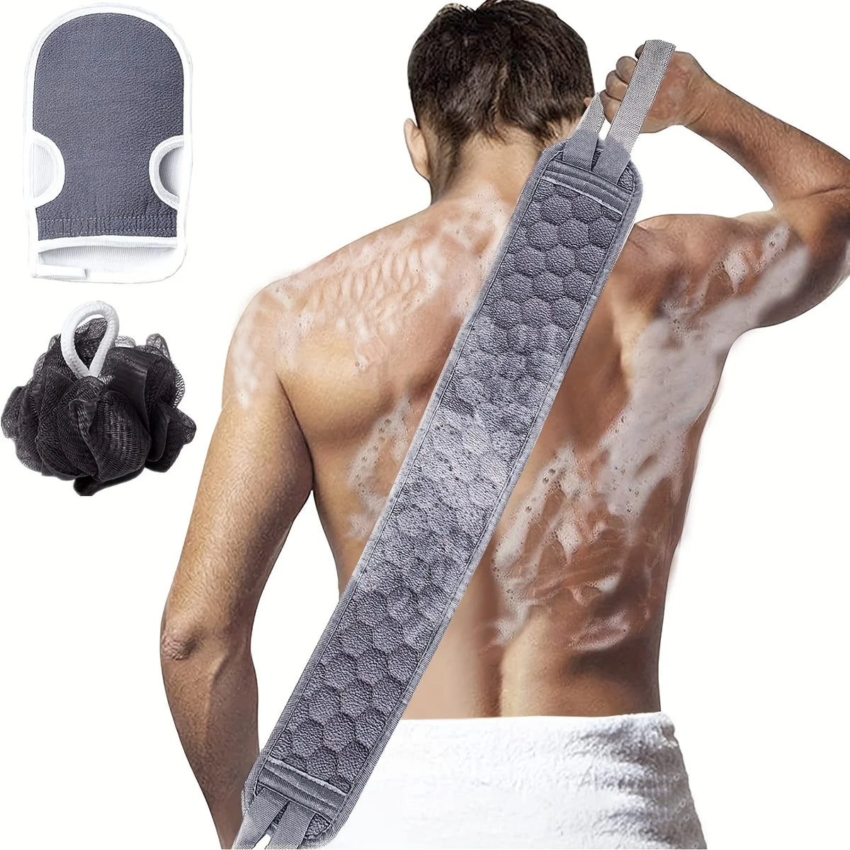 Gray back scrubber used across a man's back with the bath mitt and black loofah shown beside him