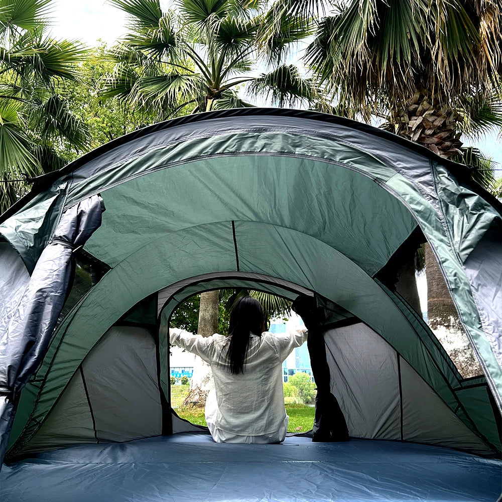 Family Pop-Up Tent green demonstration interior with a camper at the doorway; the available option is brown.