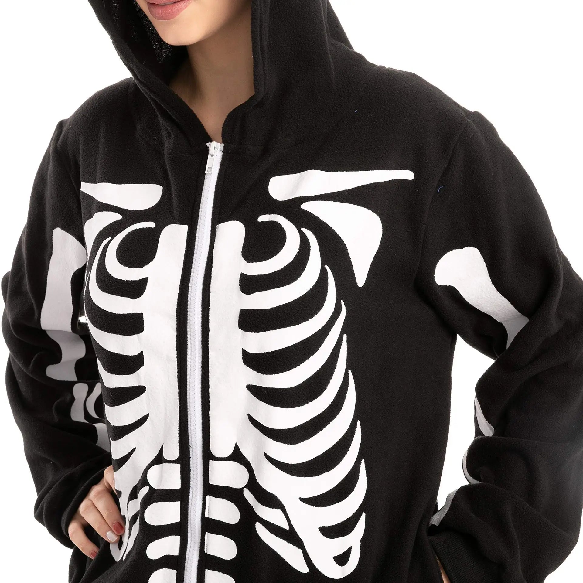 Close-up of white skeleton bone print and front zipper on black costume jumpsuit