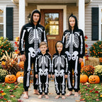 Family of four wearing matching black Family Skeleton Jumpsuits outdoors for Halloween
