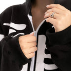 Close-up views of the skeleton jumpsuit front zipper and polyester fabric detail