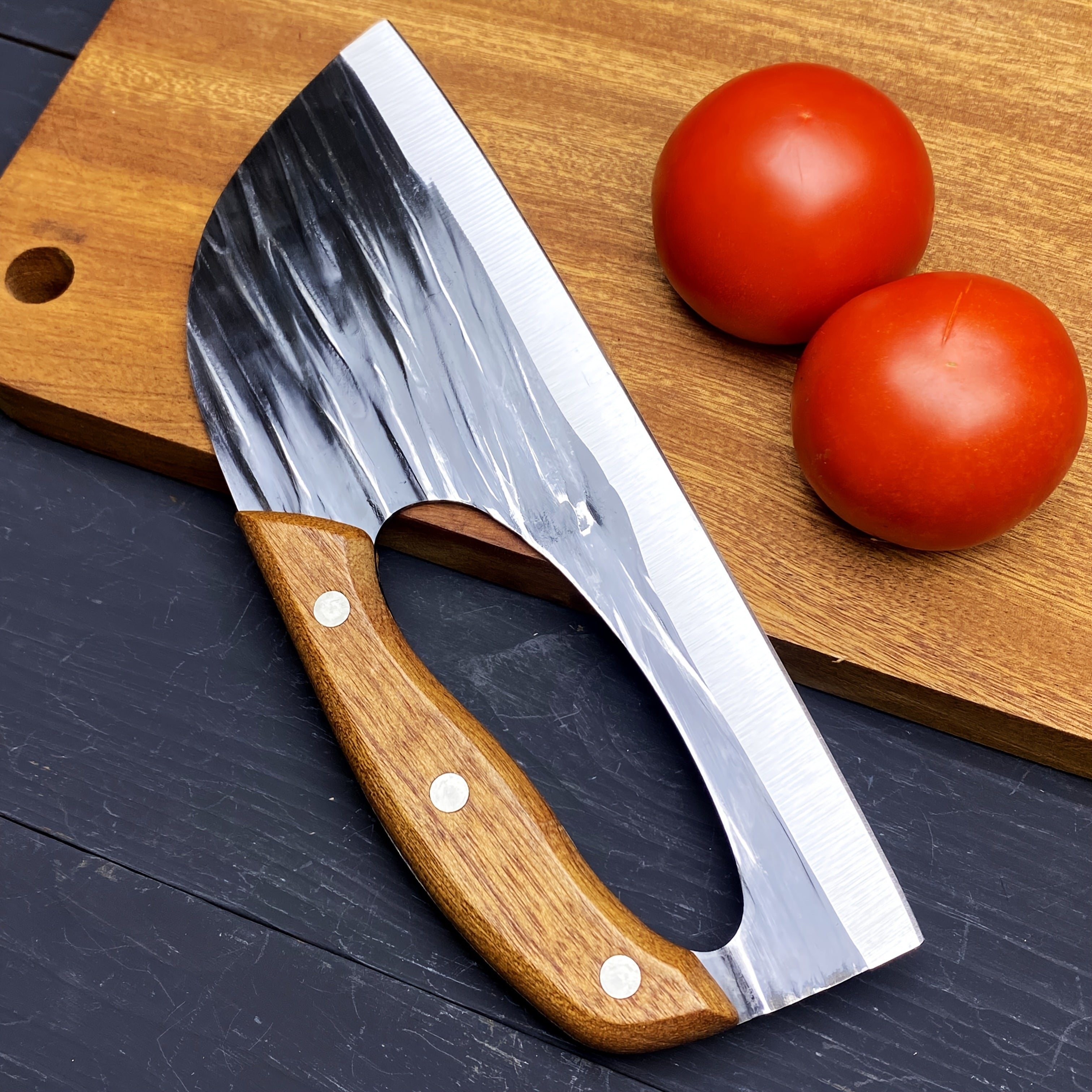 HighPeak Ergonomic Chef Knife with wooden handle and hammered steel blade beside tomatoes on wood board