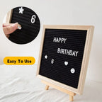 Felt Letter Board in black showing white letters and symbols pressed into the grooved surface.
