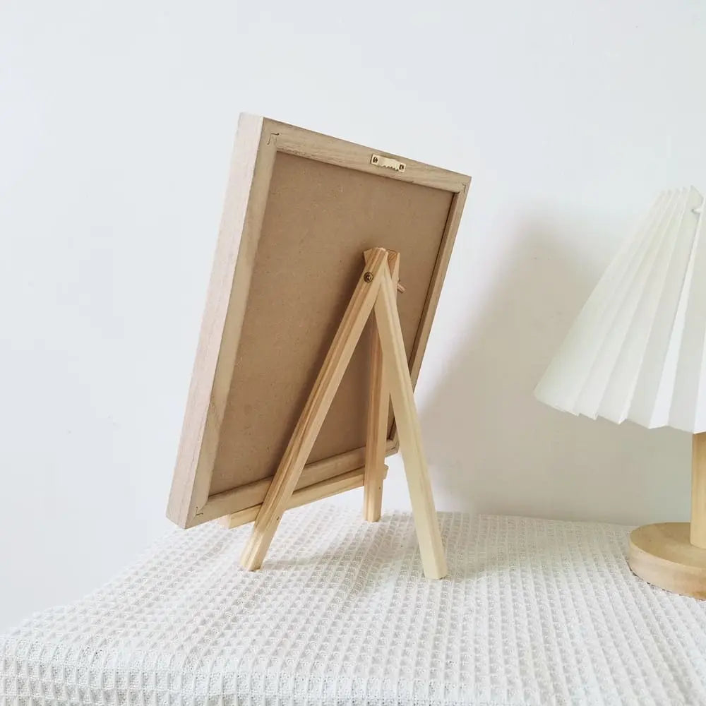 Felt Letter Board rear view showing the optional wooden tabletop stand supporting the frame.