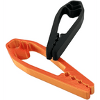 Black and orange plastic Finger-Safe Nail Holders showing stepped nail slots and textured grips