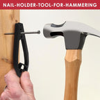 Black Finger-Safe Nail Holder gripping a nail against a wood stud beside a claw hammer
