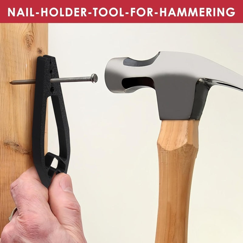 Black Finger-Safe Nail Holder gripping a nail against a wood stud beside a claw hammer