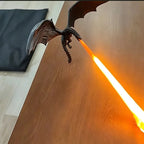 Fire-Breathing Dragon Lamp close-up showing detailed wings, claws, tail, and orange light beam