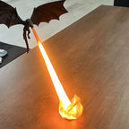 Fire-Breathing Dragon Lamp projecting an orange illuminated beam across a wooden tabletop