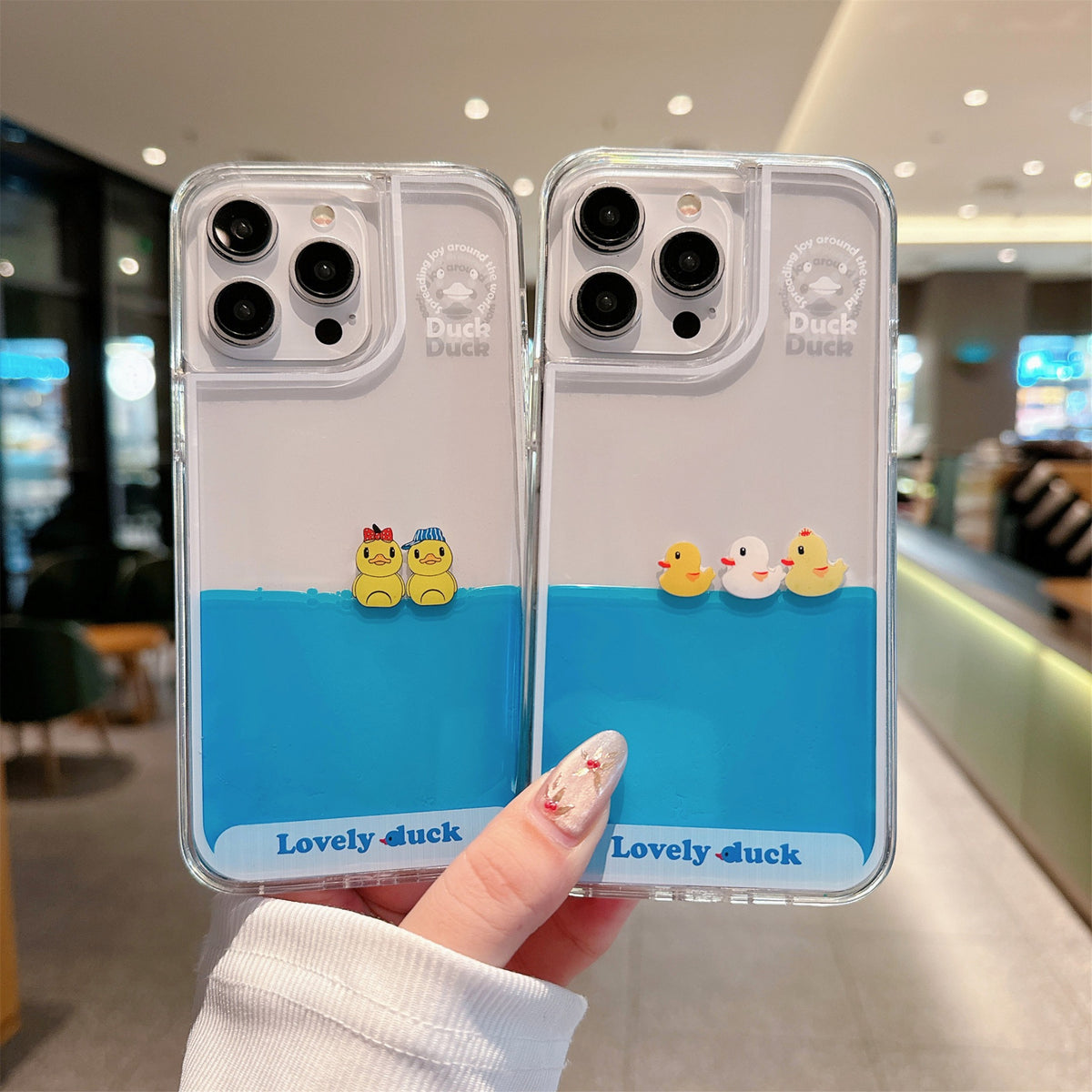 Floating Ducks Phone Case Hat Ducks and Three Ducks designs held upright side by side