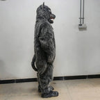 Full-Body Werewolf Costume side view indoors, showing the layered gray fur-like texture and hanging tail