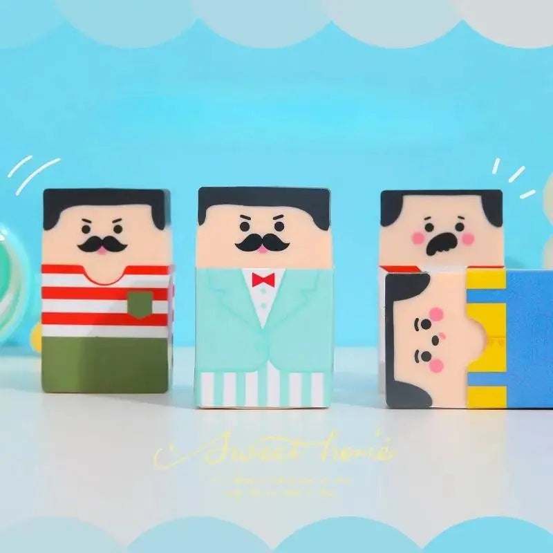 Funny Balding Man Erasers: Character erasers standing and lying down against a blue background.