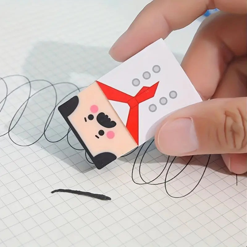 Funny Balding Man Erasers: A hand using the chef character to erase pencil marks on squared paper.