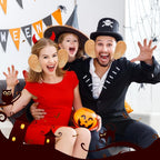 Funny Big Ears Headbands worn with red and black Halloween outfits beside a pumpkin