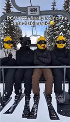 Portrait-format chairlift photo showing three yellow Funny Brickhead Ski Masks beside a black face covering