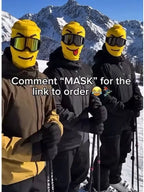 Portrait-format mountain group photo of three skiers wearing yellow Funny Brickhead Ski Masks