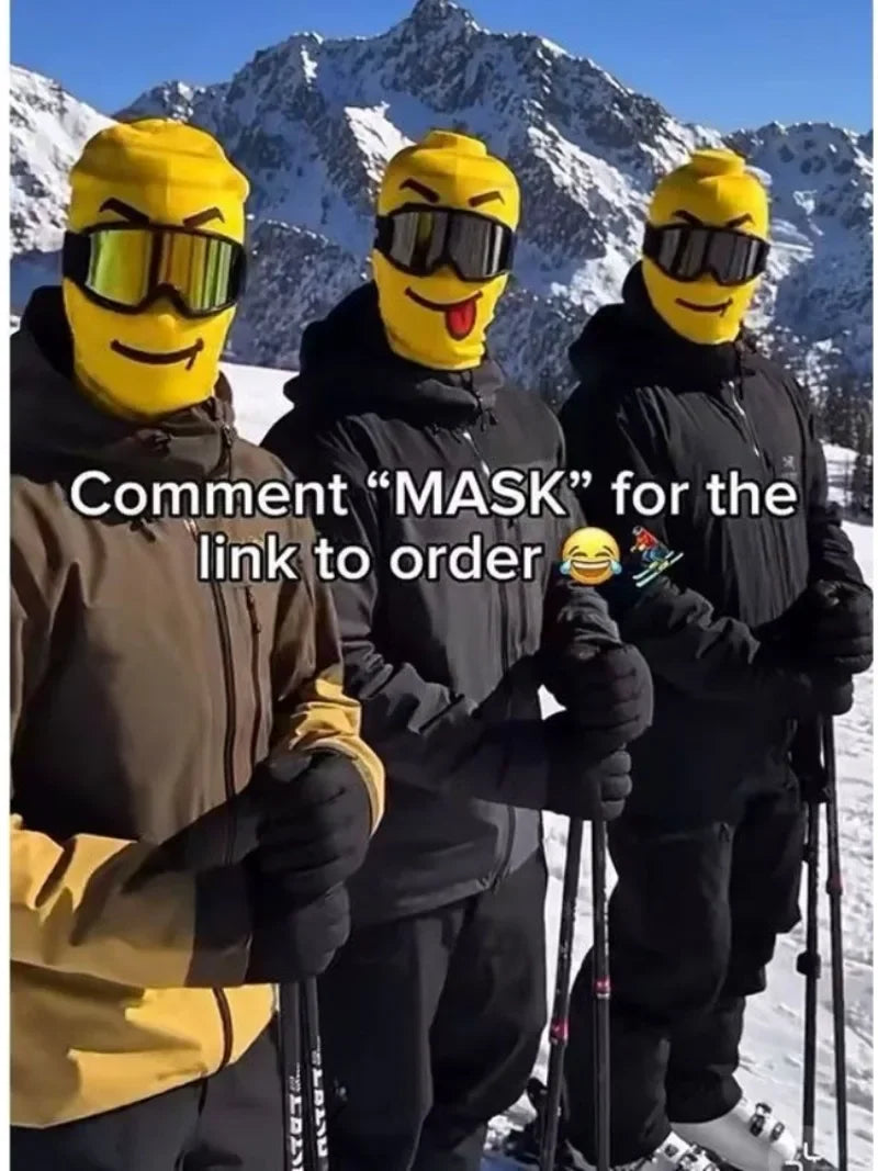 Portrait-format mountain group photo of three skiers wearing yellow Funny Brickhead Ski Masks