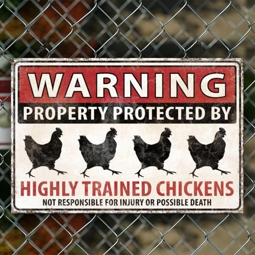 Funny Chicken Warning Sign close-up on a chain-link fence with four chicken silhouettes