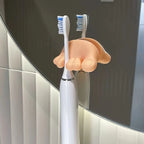 Funny Feet Toothbrush Holders securing two electric toothbrushes against a round bathroom mirror