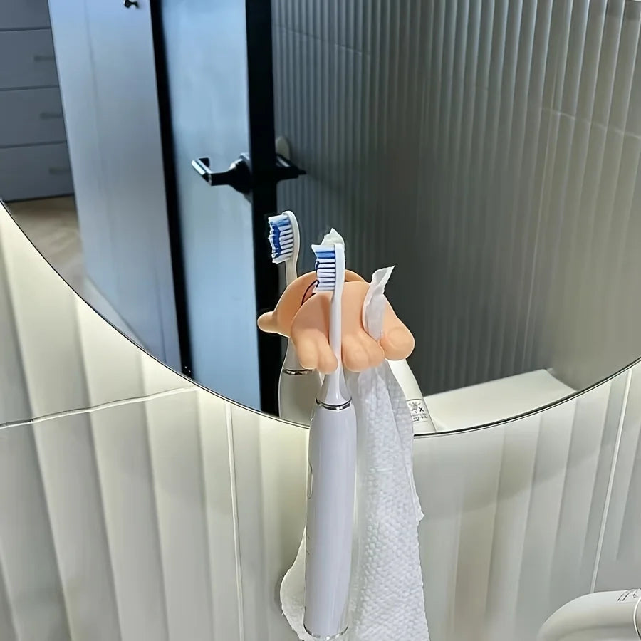 Funny Feet Toothbrush Holders supporting two electric toothbrushes and a white washcloth by a mirror
