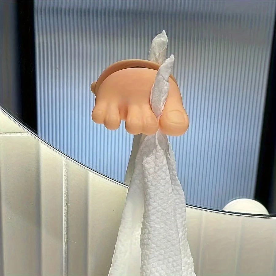 Funny Feet Toothbrush Holder used as a playful mirror-mounted hook for a white washcloth