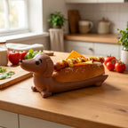 Funny Hot Dog Tray holding a hot dog in a bright home kitchen beside flowers and utensils.